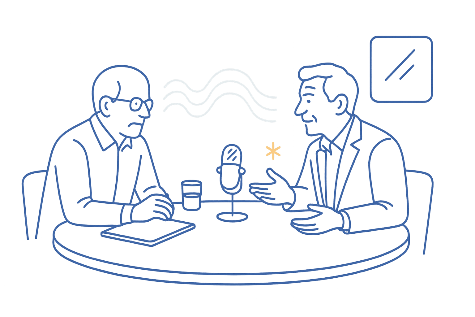 Two business leaders seated at a table having a thoughtful conversation with a microphone between them.