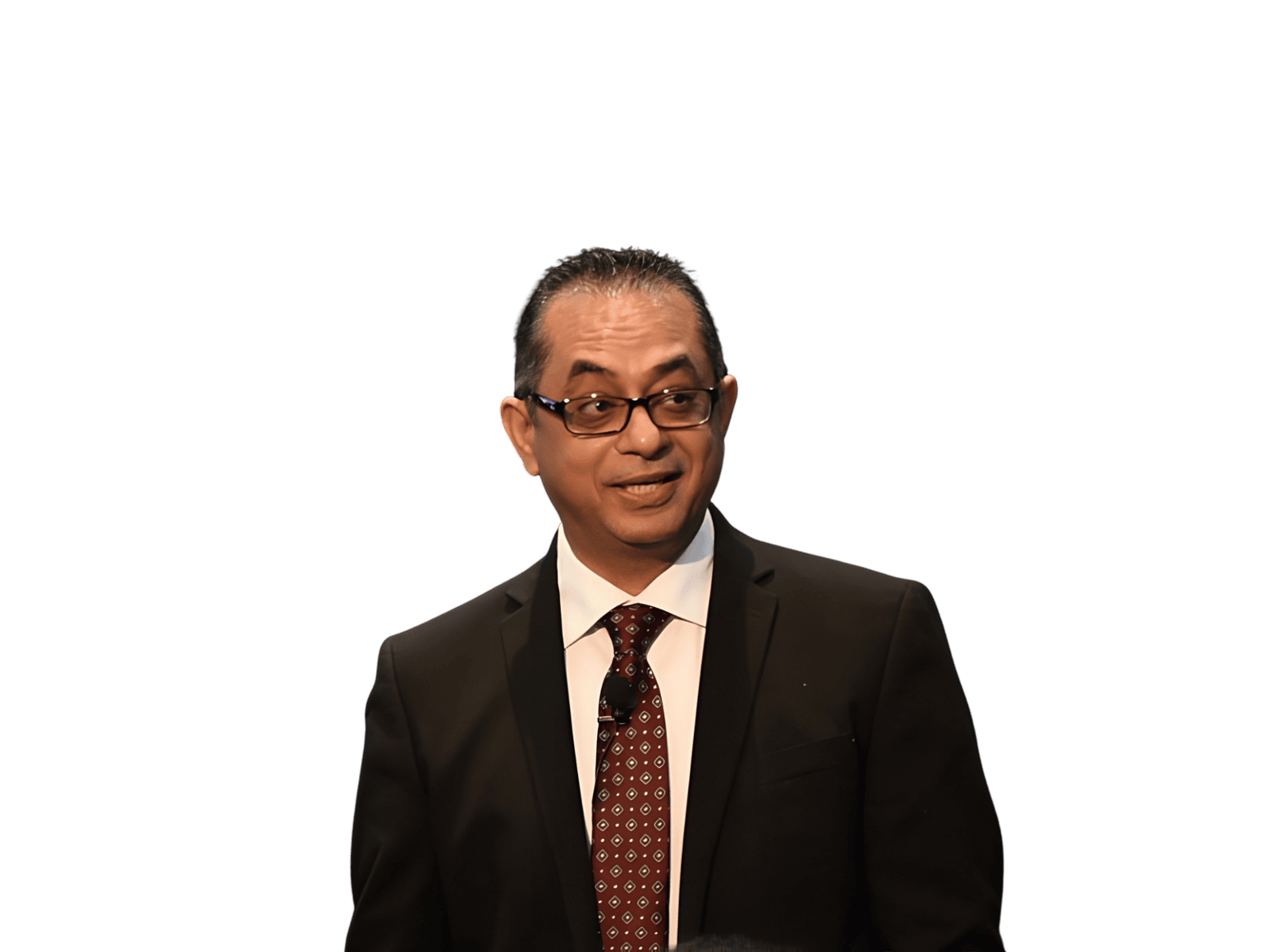 Professional speaker in a business suit addressing an audience, standing against a dark gradient background with introductory text and call-to-action buttons